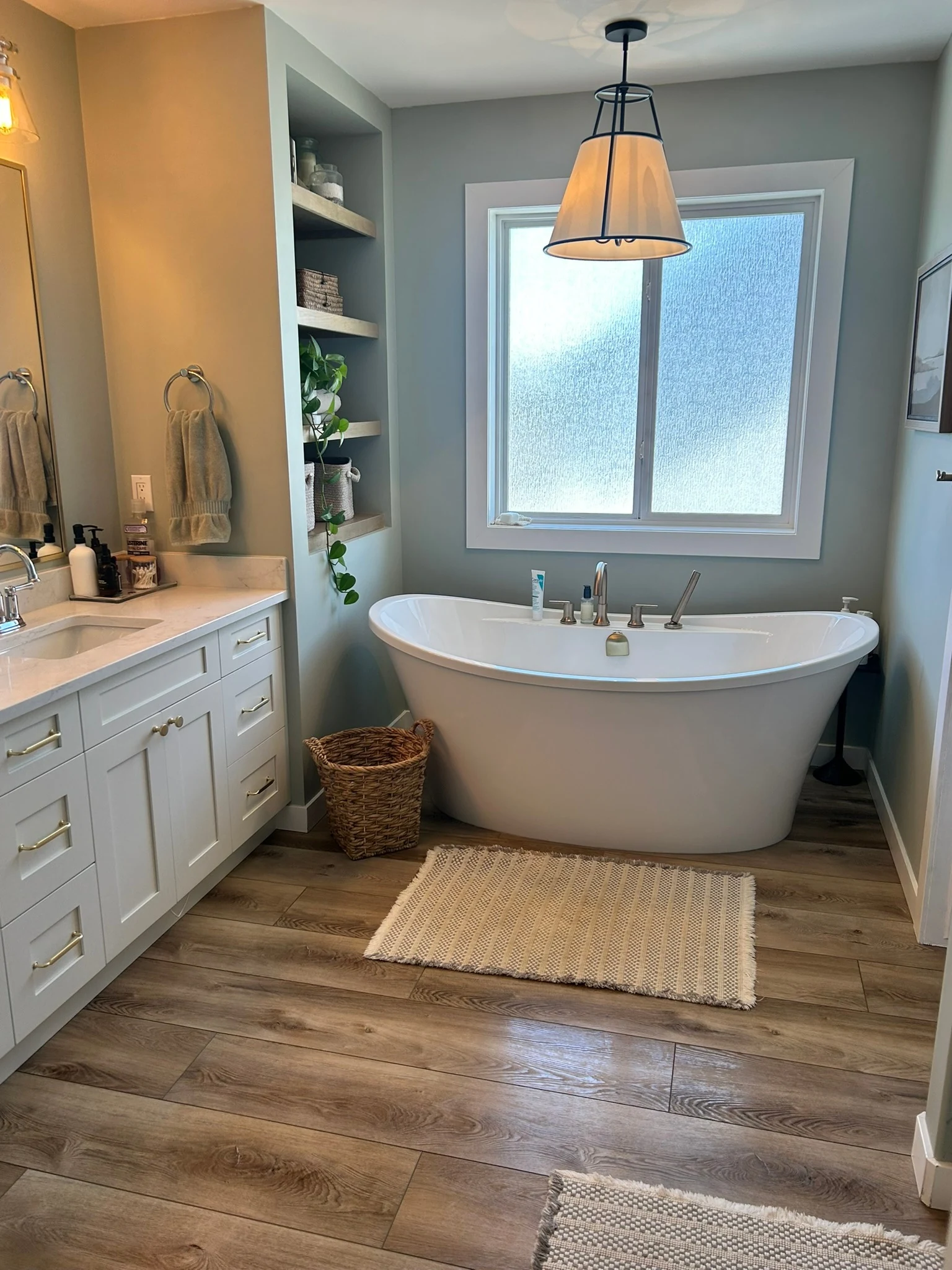 Clean bathroom with freestanding bathtub and shower